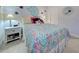 bedroom with a full-size bed, coastal decor and plenty of natural light at 26724 Weiskopf Dr, Englewood, FL 34223