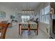 Bright dining area with view into the living room and kitchen at 26724 Weiskopf Dr, Englewood, FL 34223