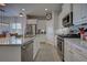 Spacious kitchen featuring stainless steel appliances and an island at 26724 Weiskopf Dr, Englewood, FL 34223