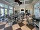 Spacious clubhouse with dining area and fireplace at 26724 Weiskopf Dr, Englewood, FL 34223