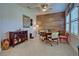 Small breakfast nook with a wooden wall and a round table at 26724 Weiskopf Dr, Englewood, FL 34223