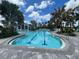 Resort-style pool with lap lanes and surrounding lounge chairs at 26724 Weiskopf Dr, Englewood, FL 34223