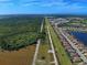 Aerial view of a community with a large undeveloped area at 26724 Weiskopf Dr, Englewood, FL 34223