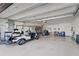 Spacious two-car garage with golf cart and storage at 26724 Weiskopf Dr, Englewood, FL 34223