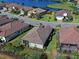 Aerial view of the back of a house with a screened enclosure at 26724 Weiskopf Dr, Englewood, FL 34223