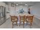 Modern kitchen with stainless steel appliances and island at 26724 Weiskopf Dr, Englewood, FL 34223