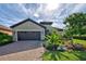Charming one-story house with a landscaped yard and brick driveway at 26724 Weiskopf Dr, Englewood, FL 34223