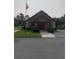 Community clubhouse with landscaping and flagpole at 1515 Forrest Nelson Blvd # A208, Port Charlotte, FL 33952