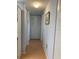 Bright hallway with tile floors and neutral-toned walls at 1515 Forrest Nelson Blvd # A208, Port Charlotte, FL 33952
