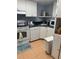 Efficient kitchen featuring white cabinets and ample counter space at 1515 Forrest Nelson Blvd # A208, Port Charlotte, FL 33952
