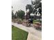 Community picnic area with tables and umbrellas at 1515 Forrest Nelson Blvd # A208, Port Charlotte, FL 33952