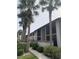 Condo building with palm trees and walkway at 1515 Forrest Nelson Blvd # A208, Port Charlotte, FL 33952