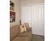 Living room with sofa, artwork, and built-in closet at 15001 Appleton Blvd, Port Charlotte, FL 33981