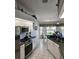 Modern kitchen with stainless steel appliances and breakfast nook at 15001 Appleton Blvd, Port Charlotte, FL 33981