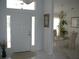 Bright entryway with tiled floors and dining area at 15001 Appleton Blvd, Port Charlotte, FL 33981