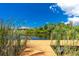 Charming dock on a tranquil waterway, perfect for enjoying peaceful moments at 9660 Miami Cir, Port Charlotte, FL 33981