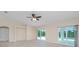 Bright living room with tile floors, sliding doors to pool area, and vaulted ceilings at 9660 Miami Cir, Port Charlotte, FL 33981