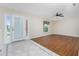 Spacious living room featuring hardwood floors and a ceiling fan at 9660 Miami Cir, Port Charlotte, FL 33981