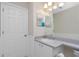 Bright bathroom with vanity, mirror, and shower at 9660 Miami Cir, Port Charlotte, FL 33981