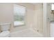 Bathroom with shower stall and a window providing natural light at 9660 Miami Cir, Port Charlotte, FL 33981