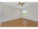 Bedroom with wood-look flooring and ceiling fan at 9660 Miami Cir, Port Charlotte, FL 33981