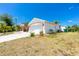 Single-story house with attached garage and palm trees at 9660 Miami Cir, Port Charlotte, FL 33981