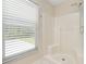 Clean bathroom with a large shower and window at 9660 Miami Cir, Port Charlotte, FL 33981