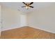Well-lit bedroom with wood-look floors and a ceiling fan at 9660 Miami Cir, Port Charlotte, FL 33981