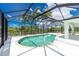 Enclosed pool with screened patio and view at 9660 Miami Cir, Port Charlotte, FL 33981