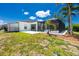Single-story house featuring a pool and a screened-in patio at 9660 Miami Cir, Port Charlotte, FL 33981