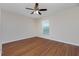 Spacious bedroom with wood flooring and ceiling fan at 9660 Miami Cir, Port Charlotte, FL 33981