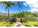 Steps from the canal, a gated dock awaits your boat at 9660 Miami Cir, Port Charlotte, FL 33981