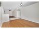 Bright dining room with hardwood floors and access to the kitchen at 9660 Miami Cir, Port Charlotte, FL 33981