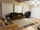 Bright living room with comfortable seating and wood flooring at 22216 Midway Blvd, Port Charlotte, FL 33952