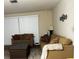 Cozy living room featuring a large sofa and coffee table at 22216 Midway Blvd, Port Charlotte, FL 33952