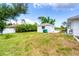 The backyard has a large, well-manicured lawn and a storage shed at 5039 Parker St, Port Charlotte, FL 33981