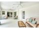 The lanai has wicker furniture, a glass table, and is sheltered from the elements at 5039 Parker St, Port Charlotte, FL 33981