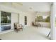 Bright lanai features comfortable seating, ceiling fans, and views of the pool at 5039 Parker St, Port Charlotte, FL 33981