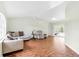 Bright and airy living room featuring hardwood floors, neutral walls, and comfortable seating at 5039 Parker St, Port Charlotte, FL 33981