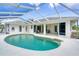 A beautiful screened pool with a large deck area for outdoor entertaining at 5039 Parker St, Port Charlotte, FL 33981