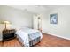 Bedroom with wood flooring and access to kitchen at 5039 Parker St, Port Charlotte, FL 33981