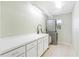 Laundry room with stacked washer/dryer and cabinets at 5039 Parker St, Port Charlotte, FL 33981