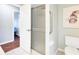 Bathroom with shower, toilet, and access to bedroom at 5039 Parker St, Port Charlotte, FL 33981