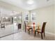Small dining area with table and chairs, near sliding doors to lanai at 5039 Parker St, Port Charlotte, FL 33981