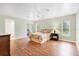 Main bedroom with wood-look floors, neutral walls, and ceiling fan at 5039 Parker St, Port Charlotte, FL 33981