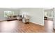 Spacious living room featuring a comfortable seating area and wood-look floors at 5039 Parker St, Port Charlotte, FL 33981
