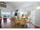Living room with ocean view, glass-top dining table and comfy seating at 7486 Palm Island Dr # 2422, Placida, FL 33946