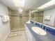Spa-like bathroom with double vanity and a large walk-in shower at 7486 Palm Island Dr # 2422, Placida, FL 33946