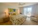 Main bedroom with a king-size bed and private balcony access at 7486 Palm Island Dr # 2422, Placida, FL 33946