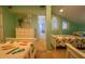 Shared bedroom area with twin beds, dresser, and access to a hallway at 7486 Palm Island Dr # 2422, Placida, FL 33946